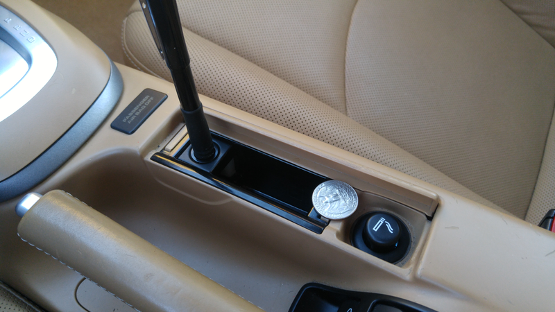 Weird little cubby. 30% cigarette lighter, 60% pocket, 10% pen holder? All too small to actually use